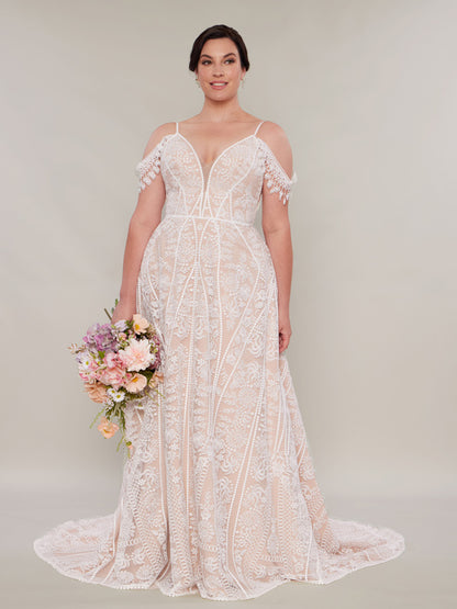  "A bohemian wedding dress style featuring intricate lace patterns, off-the-shoulder sleeves, and a fitted bodice. 