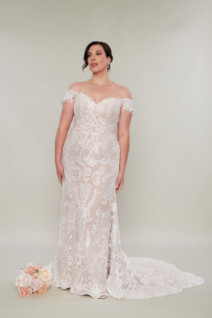 Lace sheath wedding dresses ivory on nude satin with a train and off the shoulder straps.