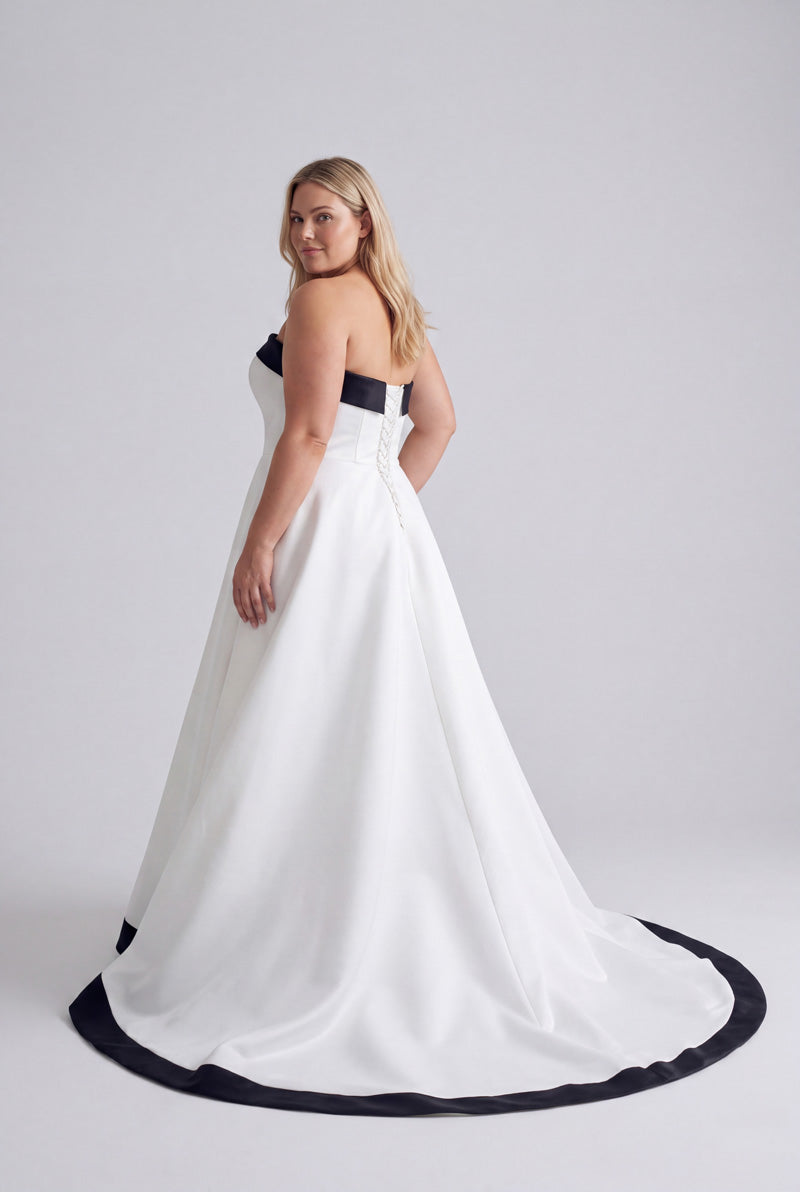 Black and white A-line bridal gown back view without optional black bow