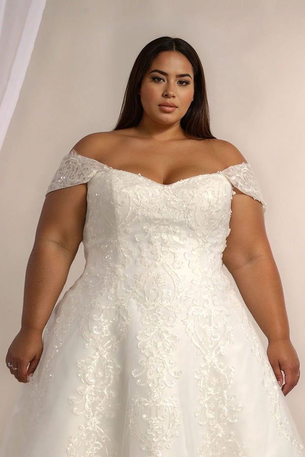 Front view of lace ballgown wedding dress with lace bodice and full skirt