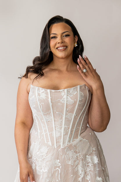 Front view of Evie lace wedding dress with a structured Basque waist