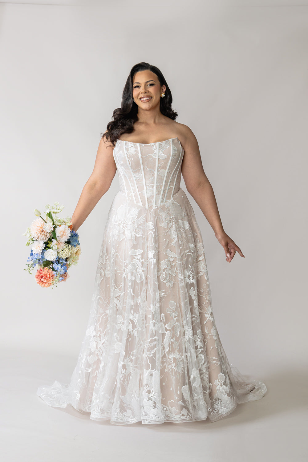 Bride wearing basque waist lace wedding dress