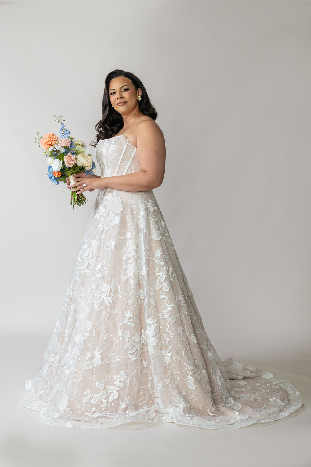 Back view of Evie ivory lace wedding dress and chapel train