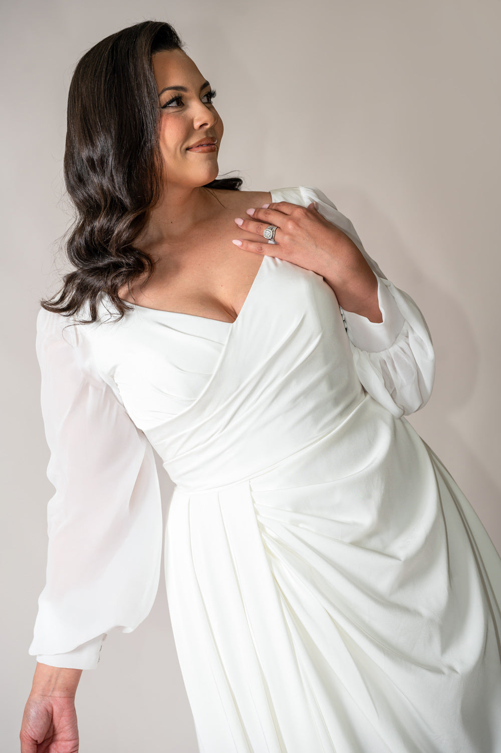 Ivory crepe wedding gown with flowing chiffon bishop sleeves