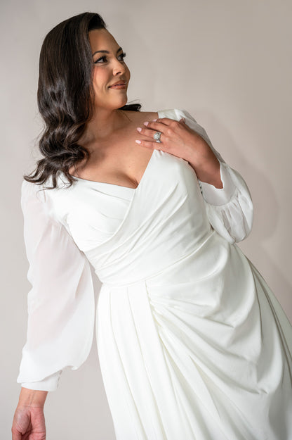 Ivory crepe wedding gown with flowing chiffon bishop sleeves