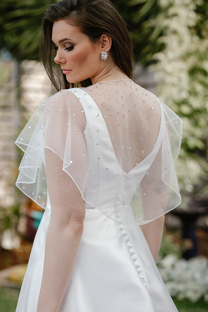 wedding dress topper sheer Violette Topper from the PARADIS Collection A sheer tulle topper, classic enough to complete any bridal look and offer a seamless transformation from ceremony to reception, can be added