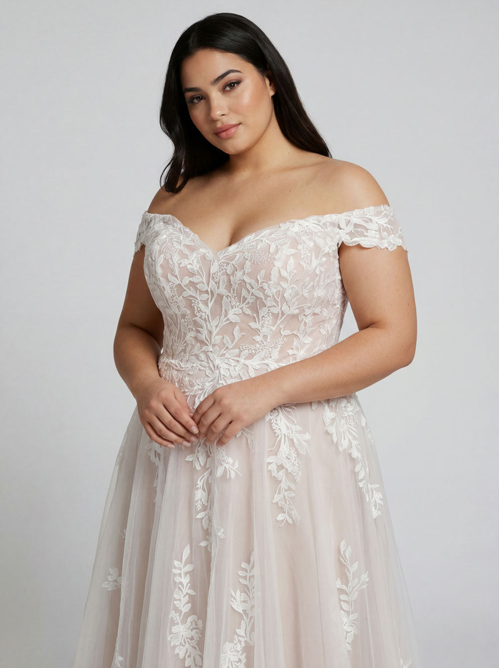 Close up of periwinkle beaded lace wedding dress bodice with off the shoulder straps and floral lace detail