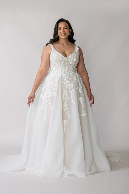 Ivory lace ball gown with straps, full tulle skirt and floral appliqué