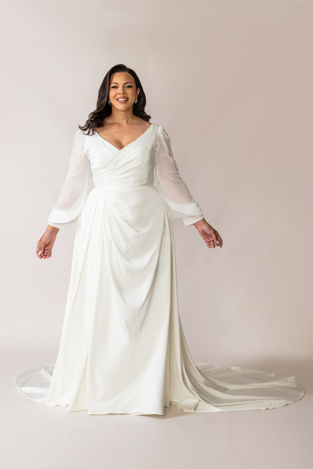 Full-length view of the Valentina ivory crepe wedding gowns