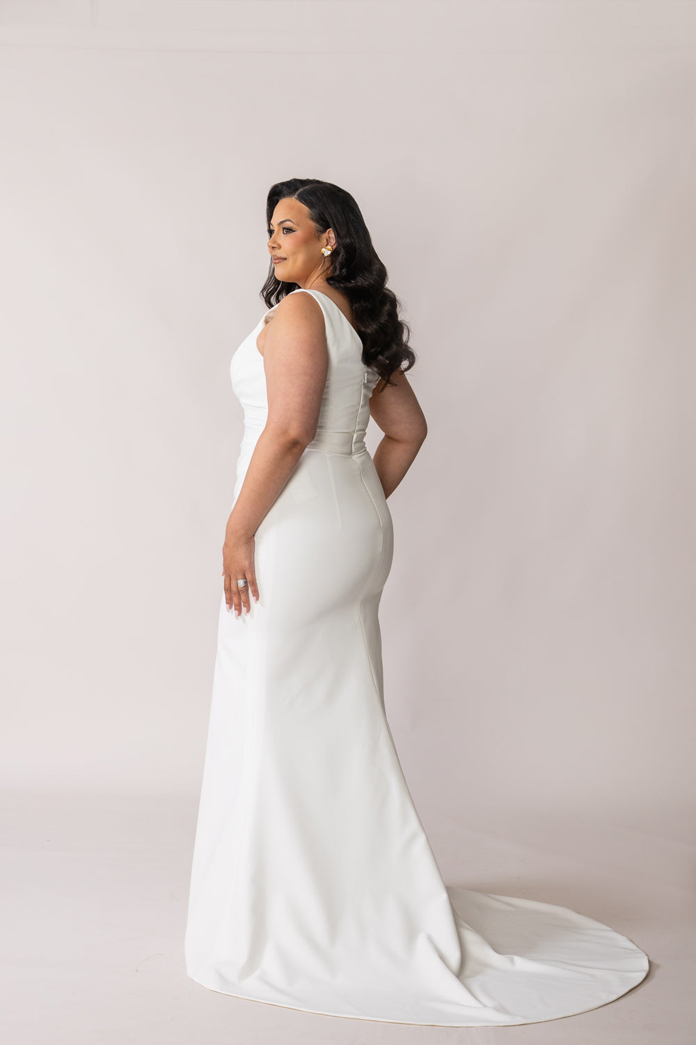 Back view of Ora satin wedding dress with a manageable bridal train