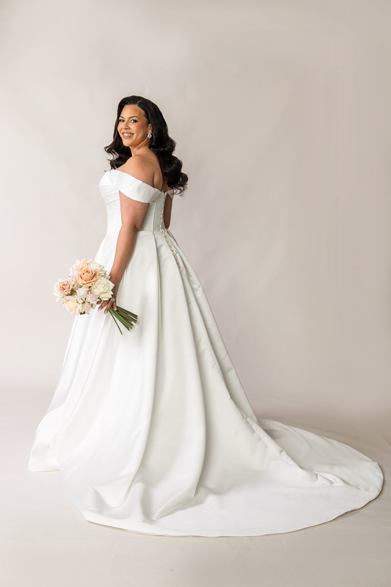 Back view of Holly satin wedding dress with lace-up corset and bridal train