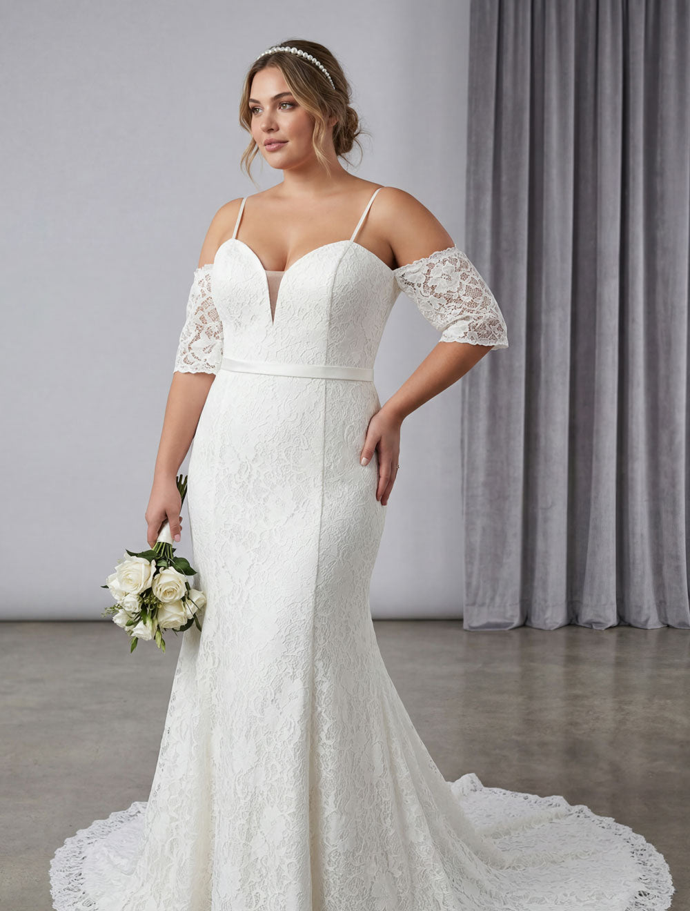 Size 22 lace fitted sample sale wedding gown with sleeves worn by bride