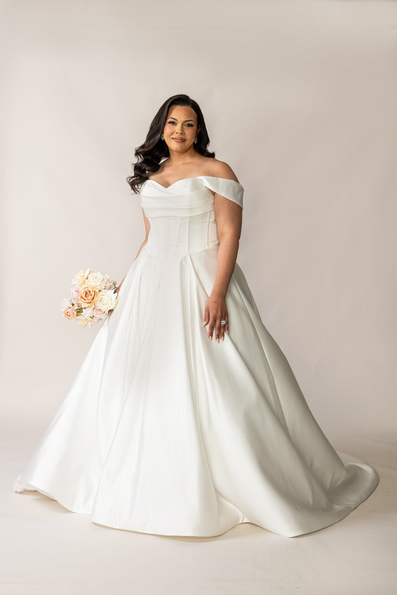 Full-length Deluxe Holly satin wedding dress with a full pleated skirt