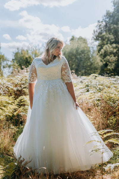 3/4 sleeve wedding dress with v-neck and lace detail